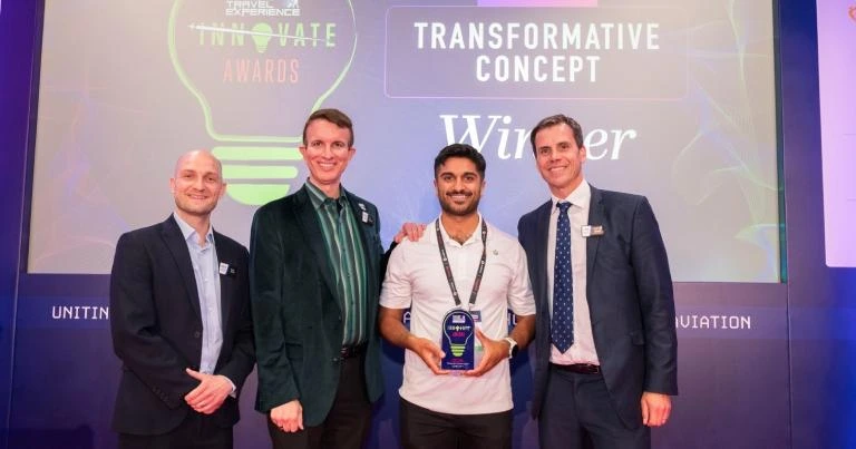 Akku accepting Arrow's FTE award alongside the organizers in Dublin, 2026