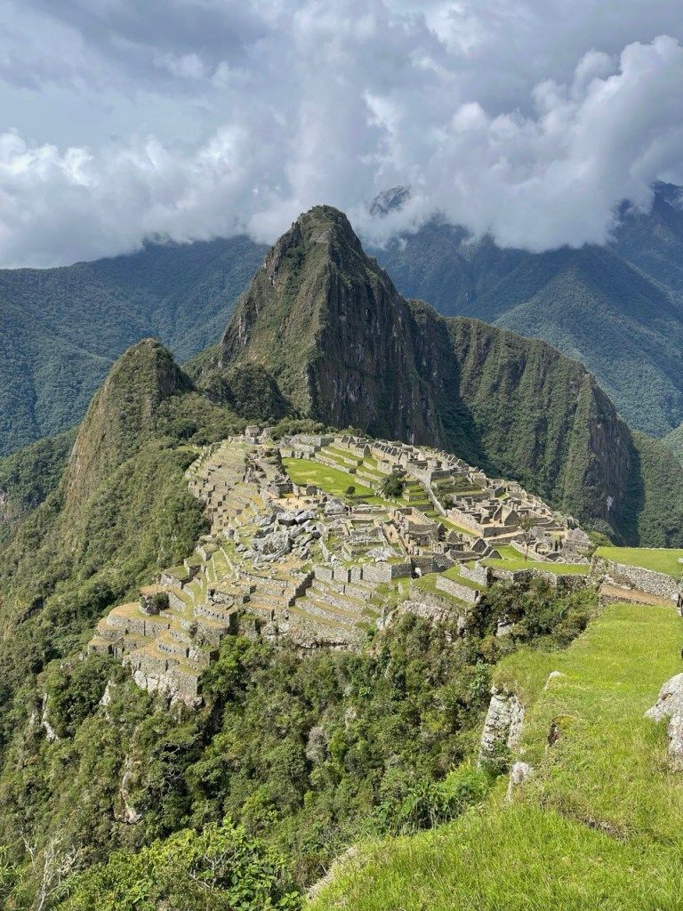 Stone ruins on a green mountain ridge