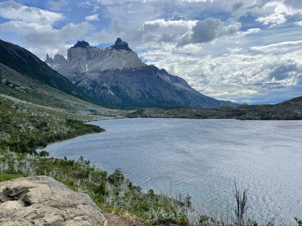 A wide lake below rocky peaks